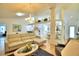 Spacious living room with a light sectional sofa and views into the kitchen and dining areas at 3258 Triple Crown Ln, Lakeland, FL 33811