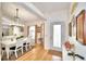 Bright dining room with white table and chairs, hardwood floors, and a chandelier at 3258 Triple Crown Ln, Lakeland, FL 33811