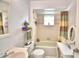 Clean bathroom with a tub, vanity, and shower at 3258 Triple Crown Ln, Lakeland, FL 33811