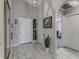 Entryway with tile floor, mirror, and access to other rooms at 653 Hidden Lakes Ct, Haines City, FL 33844