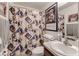 Bathroom with shower and a Mickey Mouse themed shower curtain at 653 Hidden Lakes Ct, Haines City, FL 33844