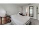 Well-lit bedroom with en-suite bathroom access and neutral decor at 653 Hidden Lakes Ct, Haines City, FL 33844