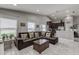 Living room with sectional sofa and kitchen view at 653 Hidden Lakes Ct, Haines City, FL 33844