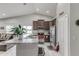 Open concept kitchen featuring granite countertops and stainless steel appliances at 653 Hidden Lakes Ct, Haines City, FL 33844