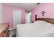 Bedroom with double bed and pink walls at 653 Hidden Lakes Ct, Haines City, FL 33844