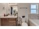 Updated bathroom with double vanity and a large mirror at 653 Hidden Lakes Ct, Haines City, FL 33844