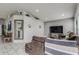 Living room with sectional sofa and large TV at 653 Hidden Lakes Ct, Haines City, FL 33844