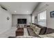 Living room with sectional sofa and large TV at 653 Hidden Lakes Ct, Haines City, FL 33844