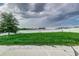 Backyard with grassy area and white vinyl fence at 653 Hidden Lakes Ct, Haines City, FL 33844