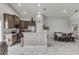 Kitchen with dark wood cabinets and an island at 653 Hidden Lakes Ct, Haines City, FL 33844