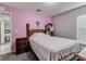 Bedroom with a double bed and pink walls at 653 Hidden Lakes Ct, Haines City, FL 33844