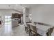 Spacious kitchen with granite countertops, stainless steel appliances, and dark wood cabinets at 653 Hidden Lakes Ct, Haines City, FL 33844