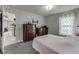 Comfortable bedroom with carpeted floors and wooden furniture at 653 Hidden Lakes Ct, Haines City, FL 33844