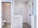 Walk-in shower with textured wall tiles and pebble floor at 5017 Ridgefield Lane, Lakeland, FL 33812