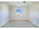 Spacious bedroom with neutral walls and carpet flooring at 5017 Ridgefield Lane, Lakeland, FL 33812