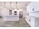 Modern kitchen with white shaker cabinets, marble countertops, and stainless steel appliances at 5017 Ridgefield Lane, Lakeland, FL 33812