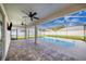 Relaxing pool area with covered patio and brick pavers at 5017 Ridgefield Lane, Lakeland, FL 33812