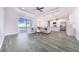 Open-concept living space with a kitchen, living area, and access to the backyard at 5017 Ridgefield Lane, Lakeland, FL 33812
