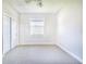 Well-lit bedroom with carpet flooring and double doors at 5017 Ridgefield Lane, Lakeland, FL 33812
