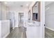 Bathroom with double vanity, walk-in shower, and access to closet at 5017 Ridgefield Lane, Lakeland, FL 33812