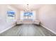 Bright dining room features hardwood floors and two comfy armchairs at 5017 Ridgefield Lane, Lakeland, FL 33812