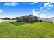Large backyard with pool and screened enclosure at 5017 Ridgefield Lane, Lakeland, FL 33812