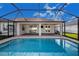 Inviting screened pool with a spacious patio at 5017 Ridgefield Lane, Lakeland, FL 33812