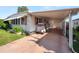 Covered carport with golf cart and storage at 619 Cassandra Ln, Lakeland, FL 33809