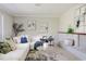 Spacious living room featuring a white sectional sofa and large windows at 215 W Carter Rd, Lakeland, FL 33813