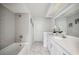 Modern bathroom with gray tile and white vanity at 4500 Old Colony Rd, Mulberry, FL 33860
