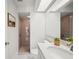Updated bathroom with gray tile shower and white vanity at 4500 Old Colony Rd, Mulberry, FL 33860