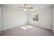 Bright bedroom with ceiling fan and neutral carpeting at 4500 Old Colony Rd, Mulberry, FL 33860