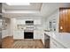 Updated kitchen featuring white shaker cabinets and stainless steel appliances at 4500 Old Colony Rd, Mulberry, FL 33860