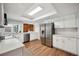 Modern kitchen with stainless steel appliances and white cabinetry at 4500 Old Colony Rd, Mulberry, FL 33860
