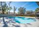 Lovely kidney-shaped pool in a fenced backyard at 4500 Old Colony Rd, Mulberry, FL 33860