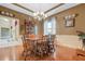 Formal dining room with hardwood floors, chandelier, and built-in hutch at 6529 Longwood Trace S Ln, Lakeland, FL 33811