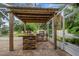 Outdoor kitchen with a built-in grill and pergola at 6529 Longwood Trace S Ln, Lakeland, FL 33811