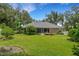 Spacious backyard with lush grass and screened patio at 6529 Longwood Trace S Ln, Lakeland, FL 33811