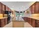 Gourmet kitchen with granite countertops and island at 6529 Longwood Trace S Ln, Lakeland, FL 33811