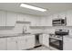Modern kitchen featuring stainless steel appliances and white cabinets at 2529 Weber St, Lakeland, FL 33801