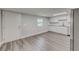 Eat-in kitchen with white cabinets, granite counters, and vinyl flooring at 2529 Weber St, Lakeland, FL 33801