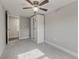 Bedroom with mirrored wardrobe and ceiling fan at 2529 Weber St, Lakeland, FL 33801