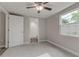 Bedroom with ceiling fan and access to bathroom at 2529 Weber St, Lakeland, FL 33801