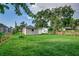 Backyard with grassy area and a small shed at 2529 Weber St, Lakeland, FL 33801