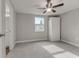 Bedroom with ceiling fan and access to bathroom at 2529 Weber St, Lakeland, FL 33801