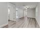 Open living room with hardwood floors and access to bathroom at 2529 Weber St, Lakeland, FL 33801