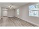 Light-filled living room with hardwood floors and access to entry at 2529 Weber St, Lakeland, FL 33801