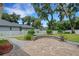 Backyard patio with brick pavers and landscaped greenery at 6529 Longwood Trace S Ln, Lakeland, FL 33811