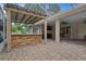Covered patio with an outdoor kitchen and built-in grill at 6529 Longwood Trace S Ln, Lakeland, FL 33811