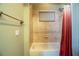 Simple bathroom with shower/tub combo and red shower curtain at 4848 Island Shores Ln, Lakeland, FL 33809